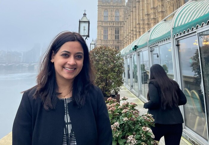 Headshot of Dr Reshma Rao standing outside of the Houses of Parliament
