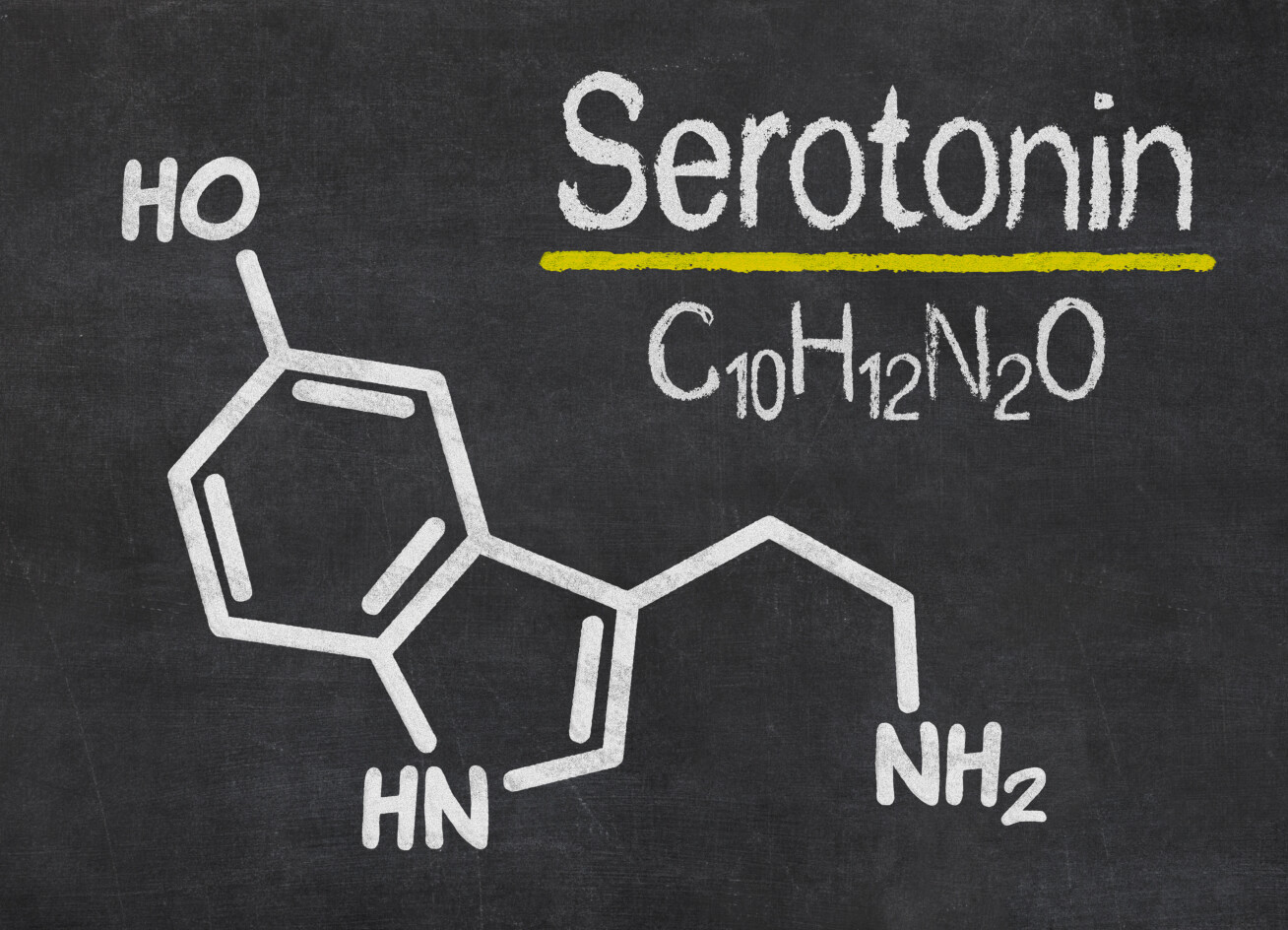 A blackboard with the serotonin molecule drawn on it